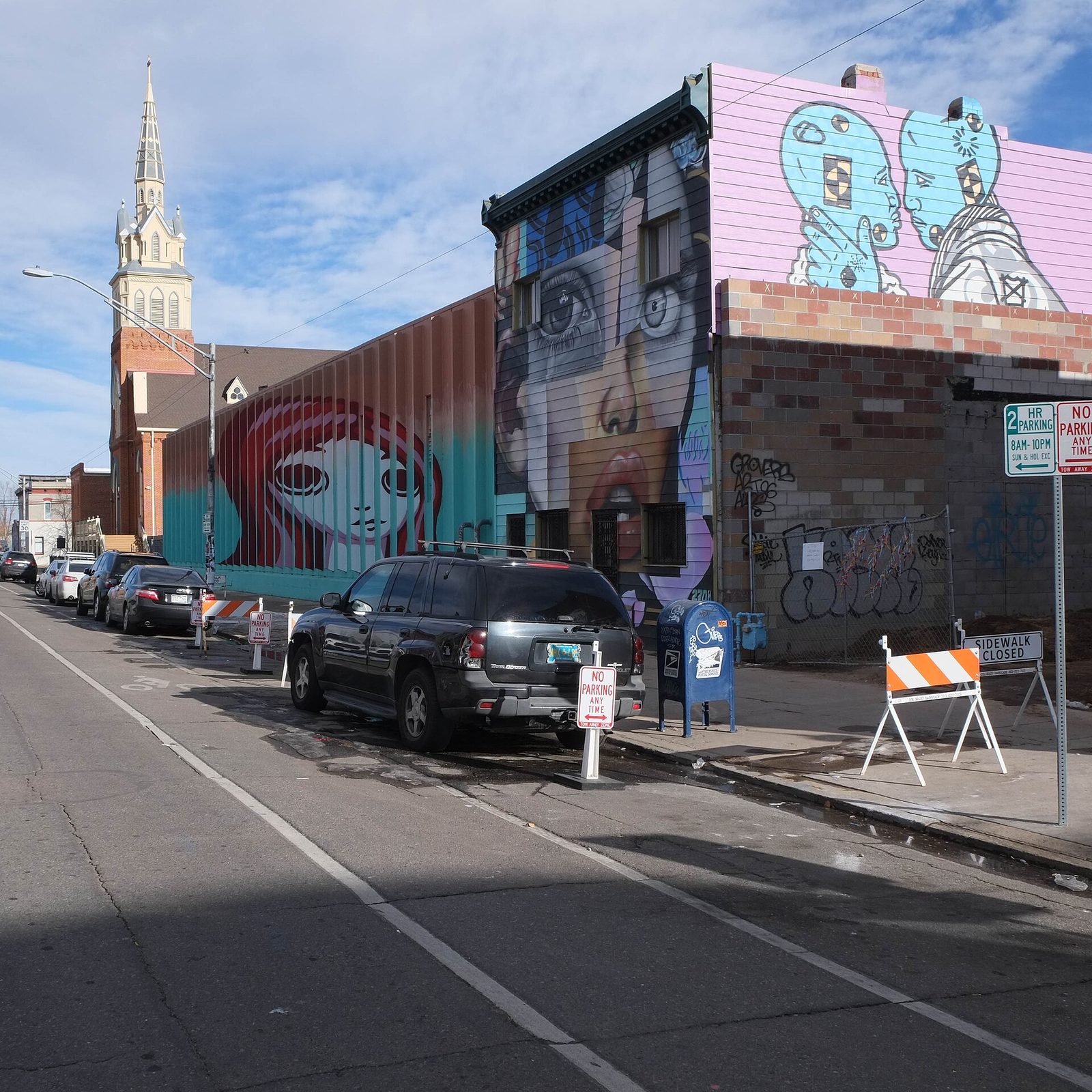 A large painted mural on a building wall in Denver's River North Art District